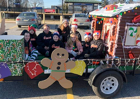 A group of people in a parade float.